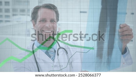 Image of graphs and increasing numbers over caucasian male doctor examining x-ray report. Digital composite, multiple exposure, report, finance, business, medical and healthcare concept.