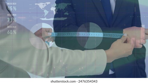 Image of graphs and infographic interface over diverse woman taking arm measurement of man. Digital composite, multiple exposure, report, business, scale, fashion designer and global concept. - Powered by Shutterstock