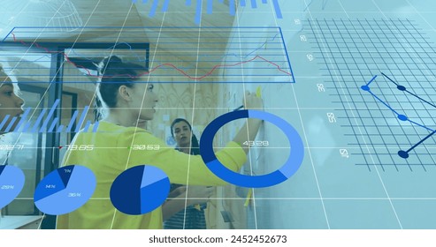 Image of graphs, loading bars and changing numbers over diverse coworkers discussing strategy. Digital composite, multiple exposure, report, business, growth, planning and teamwork concept.