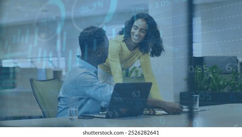 Image of graphs, loading circles, trading board, diverse coworkers discussing on desk in office. Digital composite, multiple exposure, report, business, stock market, teamwork and technology.