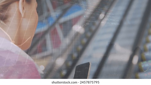 Image of graphs and trading board, caucasian woman scrolling on cellphone while using escalator. Digital composite, multiple exposure, report, business, stock market and technology concept. - Powered by Shutterstock