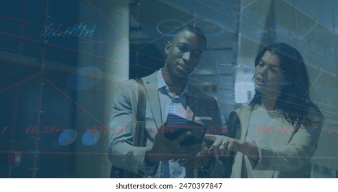 Image of graphs, trading board, loading diverse coworkers discussing while walking in office. Digital composite, multiple exposure, report, business, stock market, teamwork and technology.