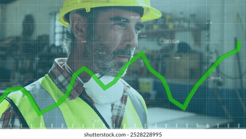 Image of green graph processing over caucasian male carpenter putting on hard hat in workshop. Connection, network, data, small business, craft and carpentry, digitally generated image.