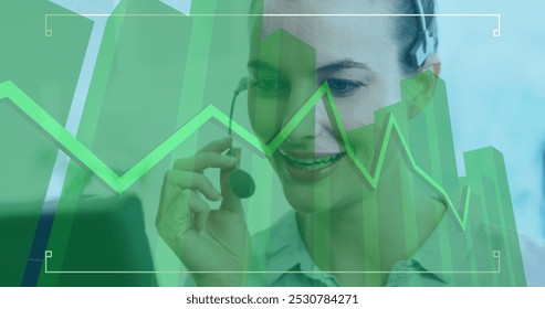 Image of a green graph rising and rolling over a Caucasian female call centre worker, talking on a phone, wearing headphones, digital composite image - Powered by Shutterstock