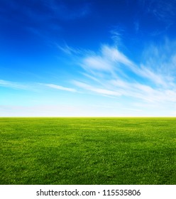 Image Of Green Grass Field And Bright Blue Sky