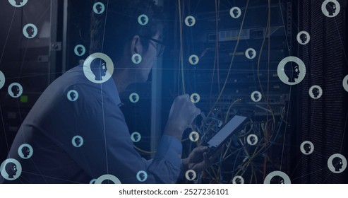 Image of grid of people icons over asian male technician working in server room. Connection, social networking, global communication and digital interface digitally generated image. - Powered by Shutterstock