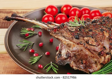 image of grilled ribs served on wooden table