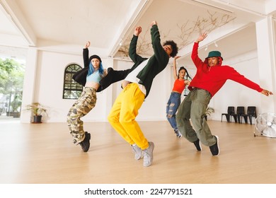 Image of group of group of diverse female and male hip hop dancers practicing in dance studio. Dance, rhythm, movement and training concept. - Powered by Shutterstock