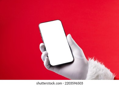 Image of hand of santa claus holding smartphone with blank screen and copy space on red background. Christmas, connection, technology, tradition and celebration concept. - Powered by Shutterstock