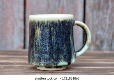 An Image Of Handmade Pottery Mug On Wooden Background