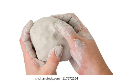 An Image Of Hands With A Ball Of Clay In Them