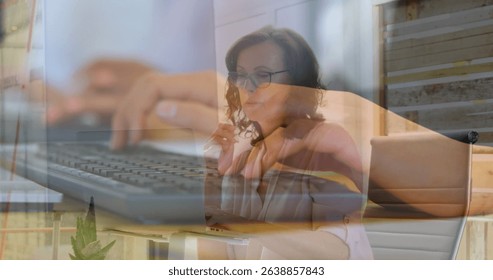 Image of hands using computers over caucasian businesswoman in office. Global business and digital interface concept digitally generated image.
