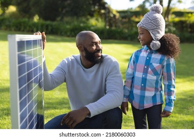 Image Of Happy African American Father Showing Solar Panels To Daughter. Family, Green Energy And Eco Awareness Concept.