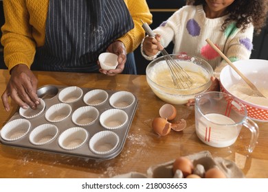 Image Of Happy African American Grandmother And Granddaughter Baking In Kitchen. Family And Spending Quality Time Together Concept.