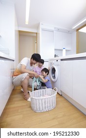 The Image Of A Happy Asian Family Doing Laundry