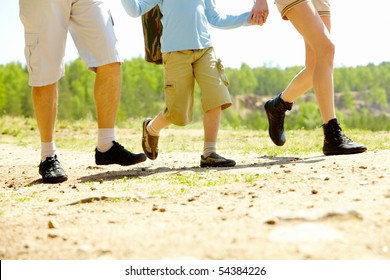 Image Of Happy Family Legs Running Down Country Road At Summer