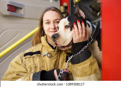 Image Of Happy Firewoman With Dog Standing Near Fire Truck