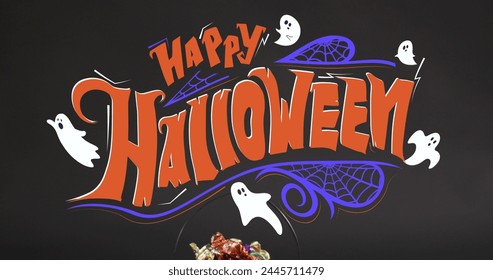 Image of happy halloween text with ghosts over orange pumpkin bucket with sweets. halloween tradition and celebration concept digitally generated image. - Powered by Shutterstock