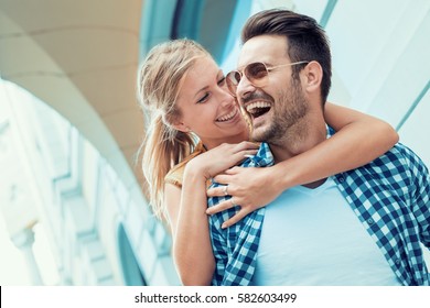 Image Of A Happy Laughing Couple In The City.