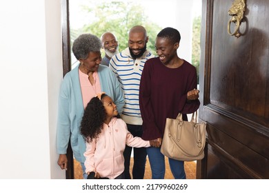 Image of happy multi generation african american family entering house. Extended family, spending quality time together concept. - Powered by Shutterstock