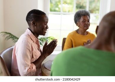 Image of happy multi generation african american family praying before breakfast. Family and spending quality time together concept. - Powered by Shutterstock