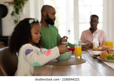 Image of happy multi generation african american family eating breakfast. Family and spending quality time together concept. - Powered by Shutterstock