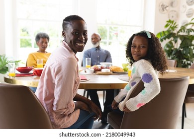 Image of happy multi generation african american family eating breakfast. Family and spending quality time together concept. - Powered by Shutterstock