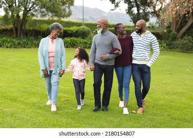 Image Of Happy Multi Generation African American Family Walking Together Outdoors. Extended Family, Spending Quality Time Together Concept.