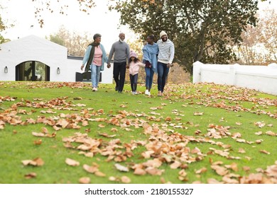 Image Of Happy Multi Generation African American Family Walking Together Outdoors In Autumn. Extended Family, Spending Quality Time Together Concept.