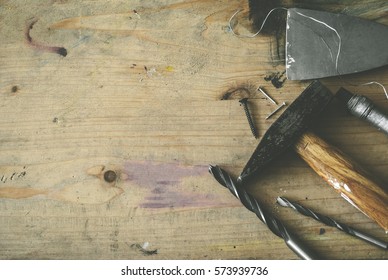 Image of hardware tools, screws and nails, on wooden background, DIY