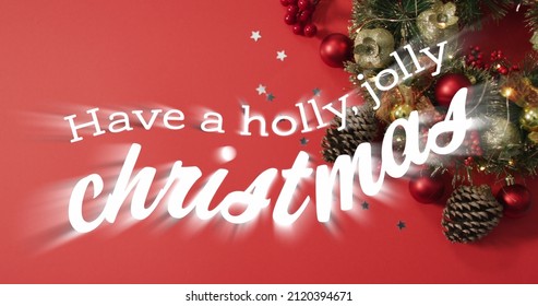 Image of have a holly, jolly christmas text over christmas decorations. christmas, winter, tradition and celebration concept digitally generated image. - Powered by Shutterstock