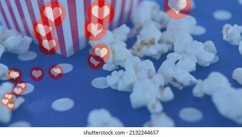 Image of heart icons over box of popcorn. popcorn day and celebration concept digitally generated image. - Powered by Shutterstock