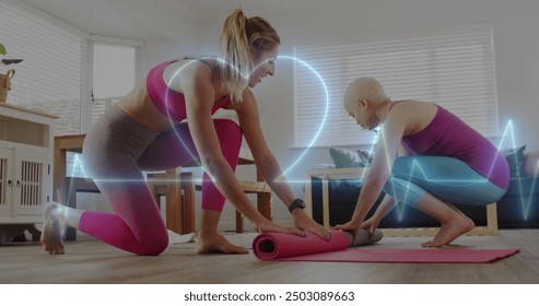 Image of heart monitor over gay lesbian couple exercising together at home. Exercise, fitness, love, relationship and happiness concept digitally generated image. - Powered by Shutterstock