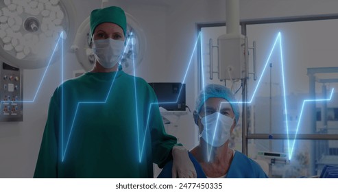 Image of heart rate monitor against caucasian male and female surgeons at hospital. Medical healthcare and research science technology concept - Powered by Shutterstock