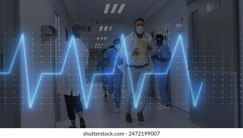 Image of heart rate monitor over diverse doctors and healthworkers running in hospital corridor. Medical healthcare and research science technology concept - Powered by Shutterstock