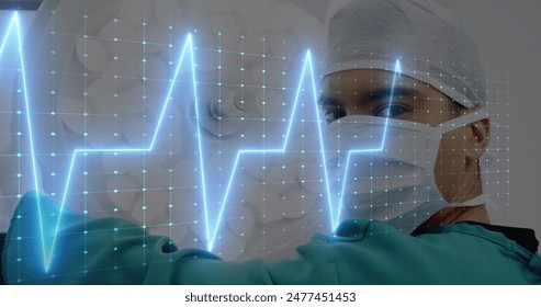 Image of heart rate monitor over biracial male surgeon in operation theatre at hospital. Medical healthcare and research science technology concept - Powered by Shutterstock