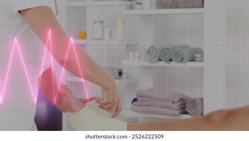 Image of heart rate monitor over caucasian female physiotherapist applying bandage to foot. Physiotherapy rehabilitation and medical healthcare concept - Powered by Shutterstock