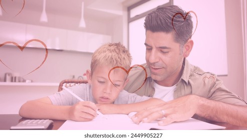 Image of hearts falling over caucasian man and his son doing homework. fashion and lifestyle concept digitally generated image. - Powered by Shutterstock