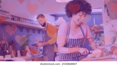 Image of hearts over happy diverse couple preparing meal. Love, romance, lifestyle and family time concept digitally generated image. - Powered by Shutterstock