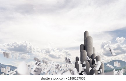 Image of high and huge stone columns located outdoors among flying papers with beautiful landscape on background. Wallpaper, backdrop with copyspace. - Shutterstock ID 1188137035