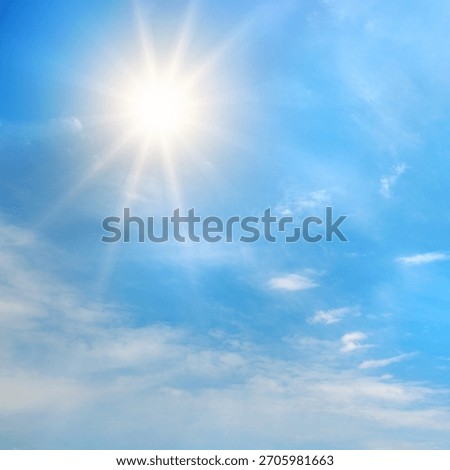 The image highlights natural light and weather conditions. The contrast between the radiant sun and soft clouds adds depth and visual interest.