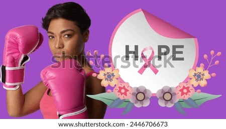 Image of hope text over african american woman wearing boxing gloves on purple background. breast cancer positive awareness campaign concept digitally generated image.
