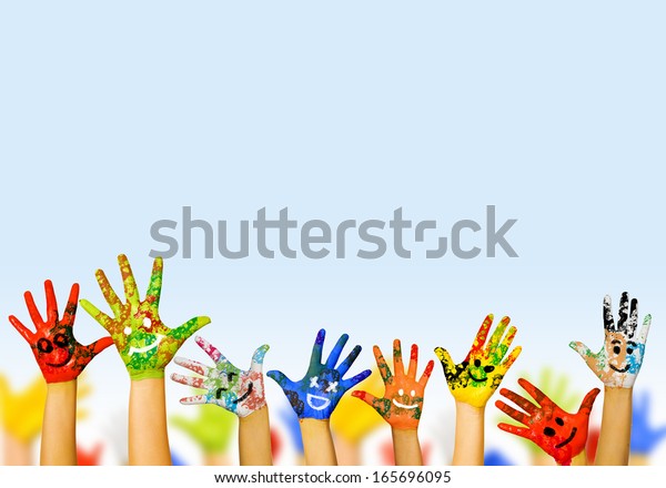 Image of\
human hands in colorful paint with\
smiles