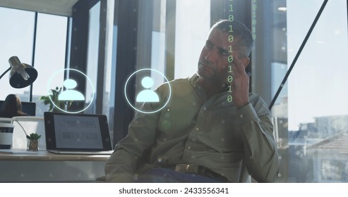Image of icons, connections and data processing over caucasian businessman in office. Global digital interface, cloud computing and data processing concept digitally generated image.