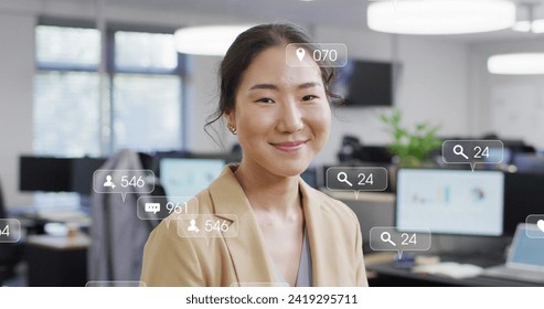 Image of icons and data processing over asian businesswoman. Global networks, business, finances, computing and data processing concept digitally generated image.