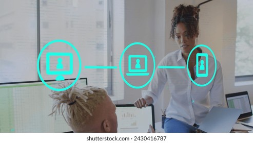 Image of icons and data processing over diverse business people in office. Global business, finances, computing and data processing concept digitally generated image.