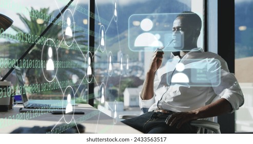 Image of icons and data processing over african american businessman working in office. Global digital interface, cloud computing and data processing concept digitally generated image.