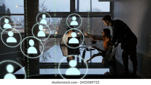 Image of icons and data processing over diverse business people working in office. Global digital interface, cloud computing and data processing concept digitally generated image.