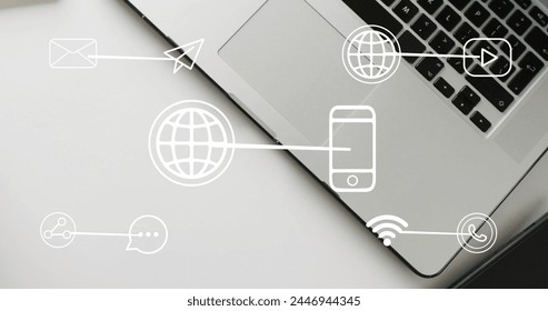 Image of icons and data processing over laptop. Global business, finances, digital interface, computing and data processing concept digitally generated image.