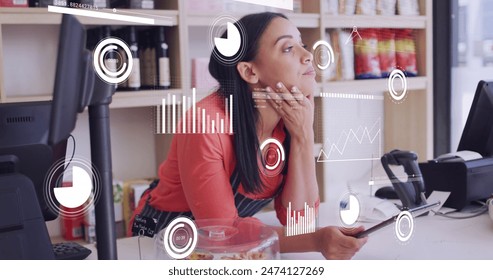Image of icons and data processing over woman with tablet in shop. Global shopping, business, finance, computing and data processing concept digitally generated image.